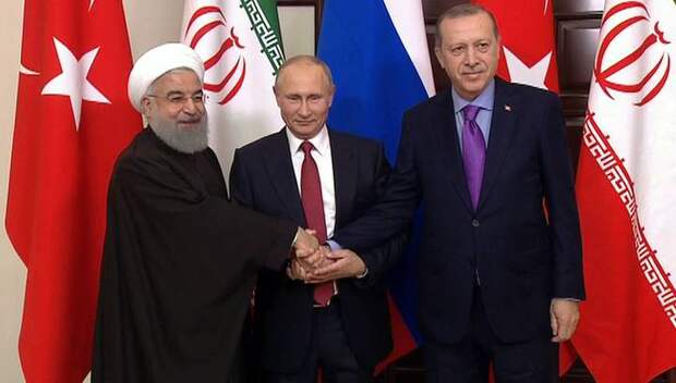 Конфуз при тройном рукопожатии: Путин вышел из неловкой ситуации с Роухани